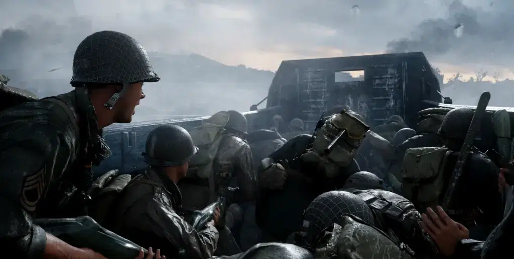 The image shows soldiers from the World War II era packed tightly inside a landing craft. The soldiers are wearing traditional WWII military helmets and gear, gripping their weapons tightly while crouching for cover. The backdrop shows a dark, cloudy sky and the ocean, indicating an intense atmosphere which is common place in the WWII Call of Duty universe.